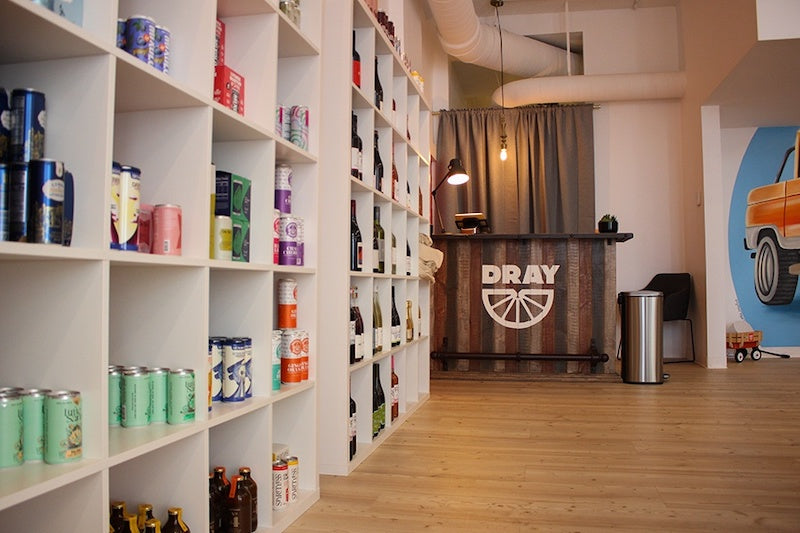A photo of the checkout counter at Dray and a side view of the wine and ready-to-drink display.